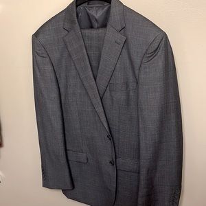 Beautiful light grey polyester blend two piece, single breasted suit.
